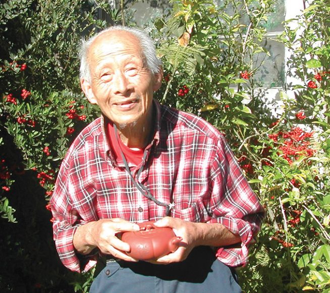 Daniel Ta-Che Yang, now 92, holding the teapot given to him by Mao Zedong for saving his life in 1925. Photographs by Nelius Ronning.