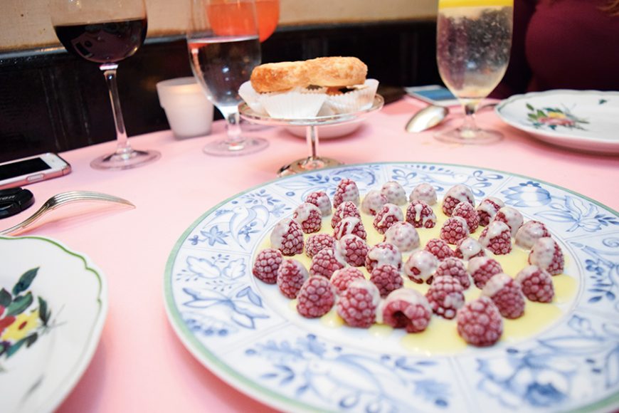 Raspberries in white chocolate sauce. Photograph by Aleesia Forni. 