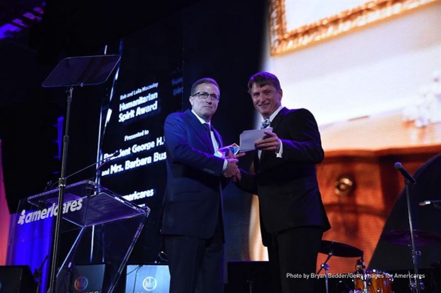 From left: Michael J. Nyenhuis, president and CEO of Americares, presents the Bob and Leila Macauley Humanitarian Spirit Award to Jonathan Bush Jr. Photograph by Bruan Bedder. Courtesy Getty Images for Americares.