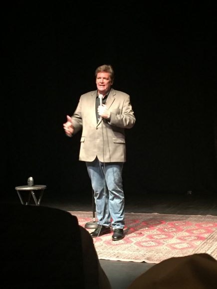 Comedian and Brewster native Tom Briscoe performs a stand-up set during the “Suits for Soldiers” event at the Schoolhouse Theater on Oct. 28. Photograph courtesy Aleesia Forni.