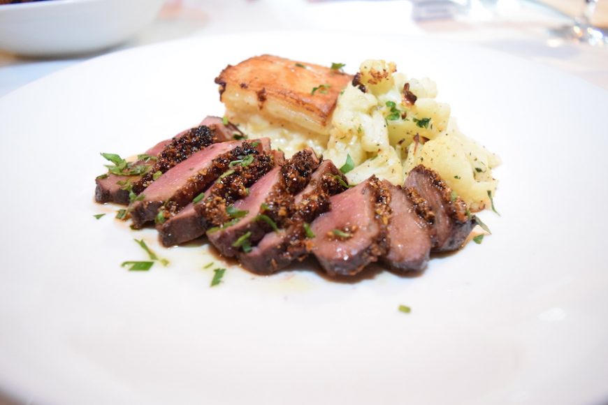 Hudson Valley magret duck breast is paired with potato gratin and roasted cauliflower. Photograph by Aleesia Forni.