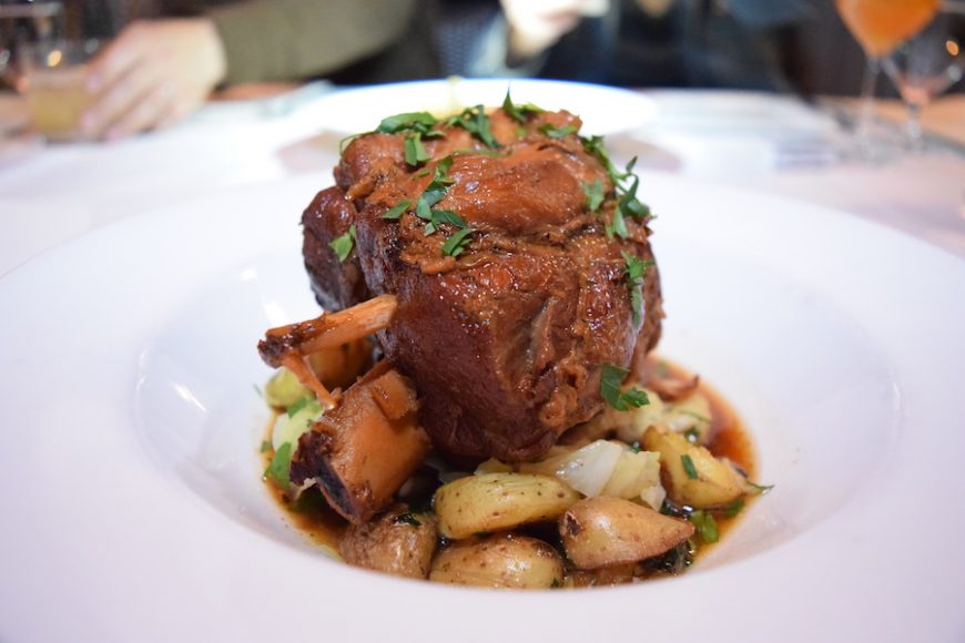 A heaping Asian braised pork shank is served on a bed of fingerling potatoes. Photograph by Aleesia Forni.