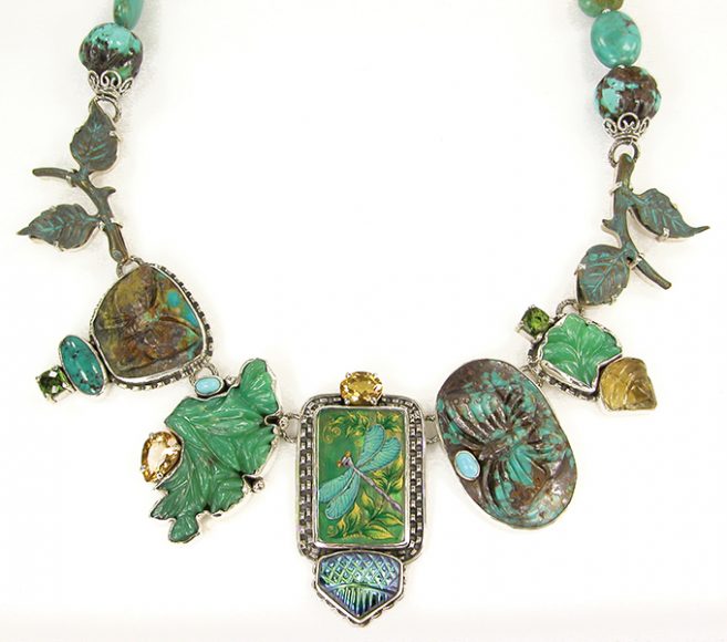 A necklace containing a handpainted Russian miniature of a dragonfly with carved turquoise and chrysoprase, citrine and peridot accents. Image courtesy Amy Kahn Russell. 