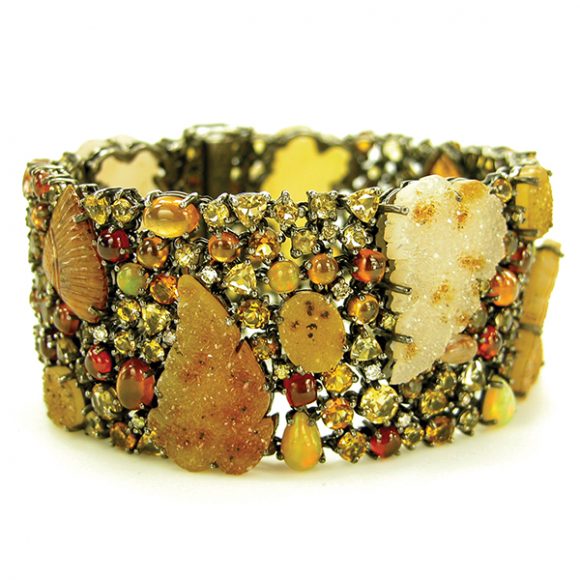 A bracelet made with hand-carved Brazilian drusy agate leaves accented with hessonite and topaz and garnet accented with white and yellow diamonds. Image courtesy Amy Kahn Russell.  
