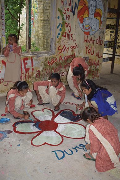 Children of the Ganges create art during a field trip to the Beatles Ashram in Rishikesh. Photograph courtesy Children of the Ganges.
