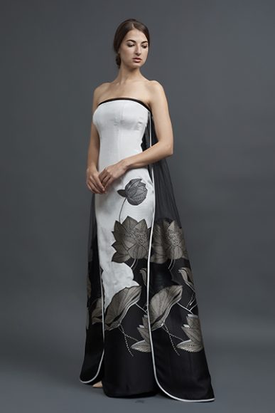 An appliquéd strapless lotus jacquard on silk faille column with an attached tulle cape with appliqué detail, $4,190. Model – Tanya Gavrilova. Photograph by Roman Makhmutov.