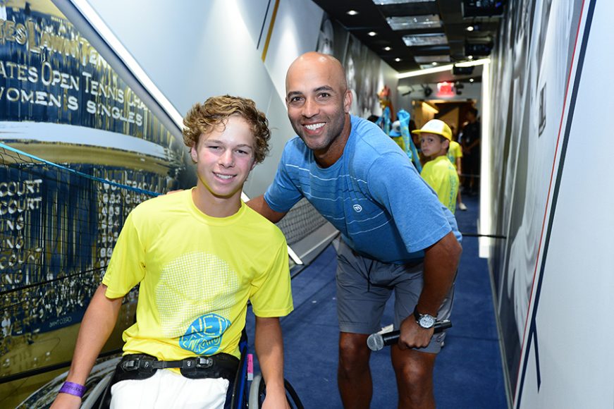 James Blake working with a youngster. Photograph courtesy USTA.