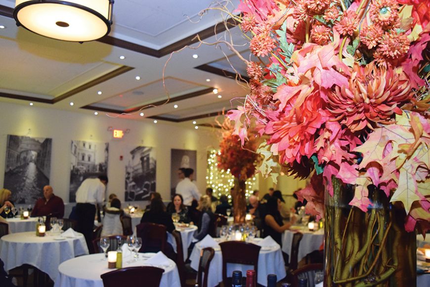 Oversize centerpieces accent Sergio’s sleek dining room. Photograph by Aleesia Forni.