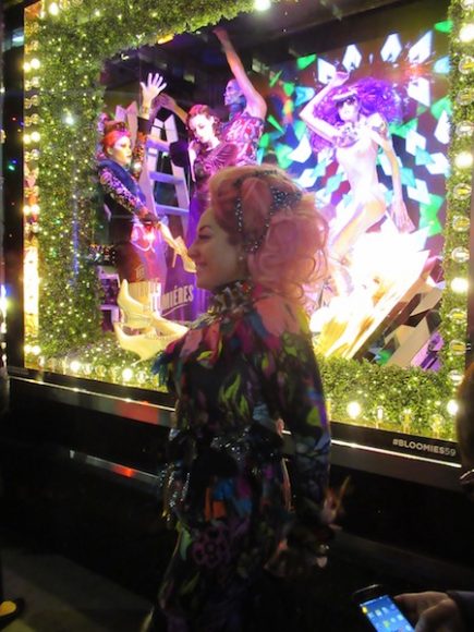 Allison Eden, the mosaic artist profiled in the December issue of WAG, poses in front of one of her holiday windows at Bloomingdale’s 59th Street in Manhattan. Photograph by Mary Shustack.