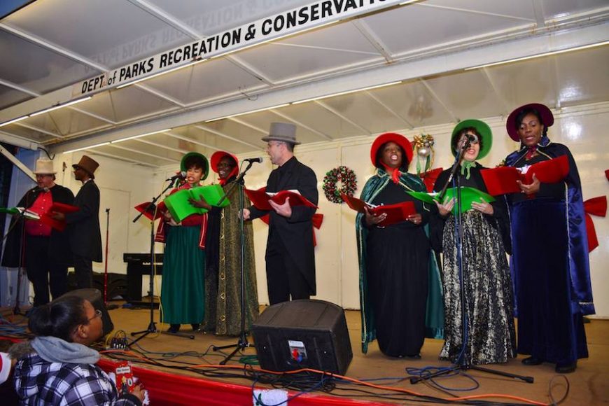 Christmas carolers sing to the crowd. Photograph courtesy Thompson & Bender.