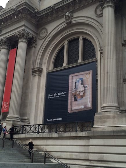 A banner for the Joseph Cornell exhibition graces the entrance to The Metropolitan Museum of Art on Fifth Avenue in Manhattan. Photograph by Mary Shustack.
