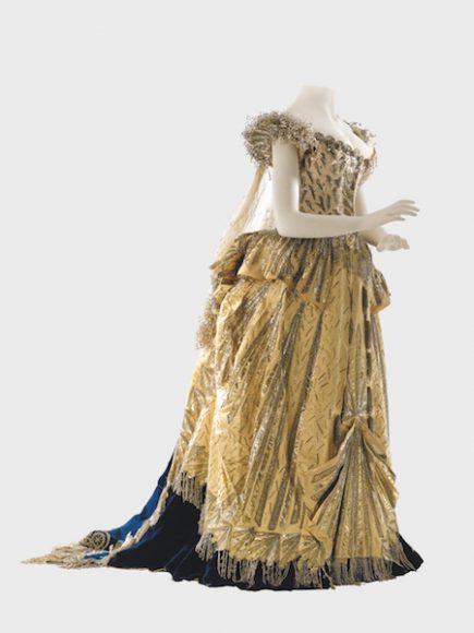 “Spirit of Electricity,” Worth, 1883. The “Spirit of Electricity” costume made by Worth for Alice Vanderbilt,” 1883. It comprises a dress of 17th-century inspiration in midnight-blue velvet, overlaid with white satin on the bodice and gold satin on the skirt, embroidered with sequins, beads, and crystals. Museum of the City of New York (51.284.3a-h). Photograph © 2011 David Arky. Courtesy Thames & Hudson.