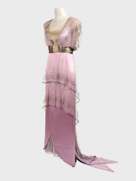 Formal dress made from two asymmetric tunics in chiffon, both longer at the back, with clover-leaf motifs embroidered in glass beads, covering a narrow silk satin underdress with a train of pointed streamers, gold lame bodice and belt, c. 1910-13. Private collection. Courtesy Thames & Hudson.
