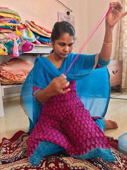 The OmLuxe Collective consists of 25 Indian women, empowered through sewing. Courtesy OmLuxe.