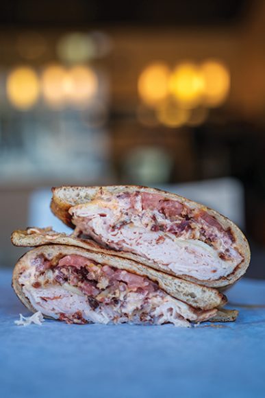 Flat bread with slow-roasted turkey breast, bacon and cheddar. Photograph by Matt Oprysk, courtesy Melt Sandwich Shop.