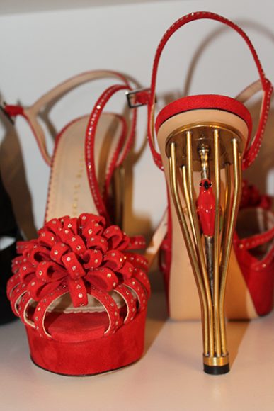 Charlotte Olympia’s Graca Pump, which reveals a colorful bird in the red heel/cage design. Photograph by Danielle Renda.