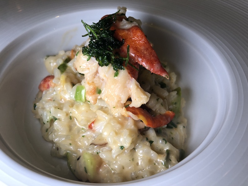 Vegetable risotto with lobster, shrimp, scallops and truffle Champagne butter.