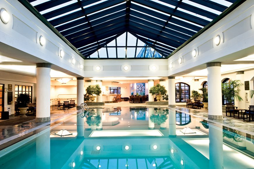 Indoor and outdoor horizon-edged swimming pool at the Spa at Charleston Place. Photograph by Joe Vaughn. Courtesy Hotel Belmond Charleston.