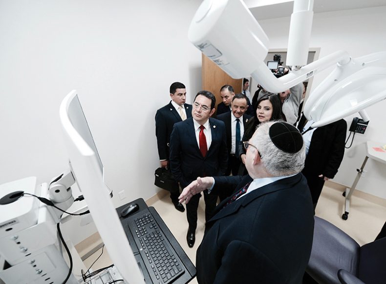 Guatemalan President Jimmy Morales, center, tours the new dental school at New York Medical College in Valhalla. Courtesy New York Medical College.