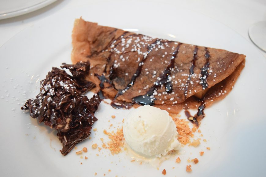 Ice cream and crunchy chocolate are served alongside a chocolate-filled crêpe. Photograph by Aleesia Forni.