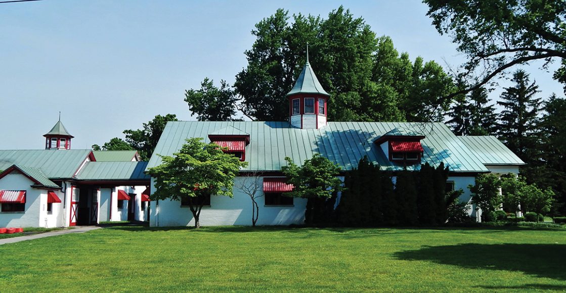 The pristine barns of Calumet Farm. Image courtesy Sloane Travel Photography.