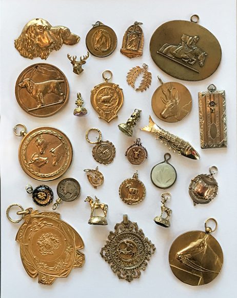 Fobs made of medals and coins. Photograph by Julie Betts Testwuide.  