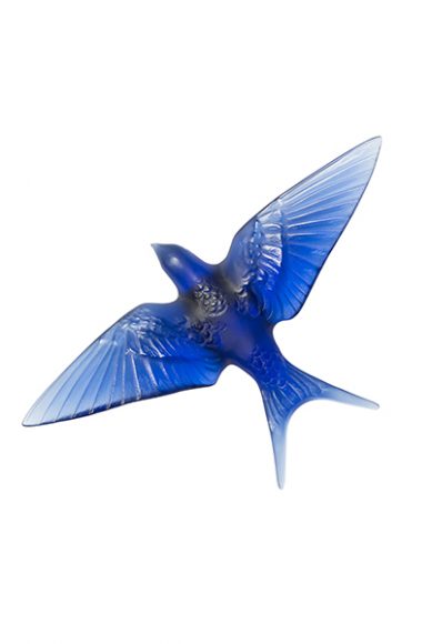 The Swallow Wings Down Wall Sculpture in sapphire blue crystal from Lalique's Hirondelles Collection. Image courtesy Lalique.
