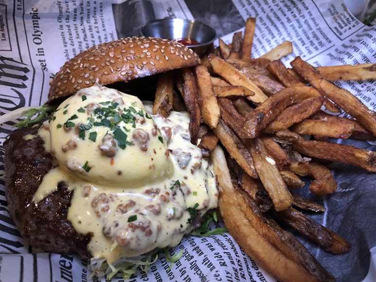 The Senior Benedict burger and crispy fries at Blue Dog. Photograph by Alessia Forni.