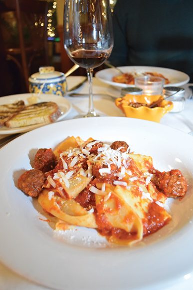 A plate of pappardelle 
is topped with miniature meatballs and meat sauce. Photograph by Aleesia Forni.