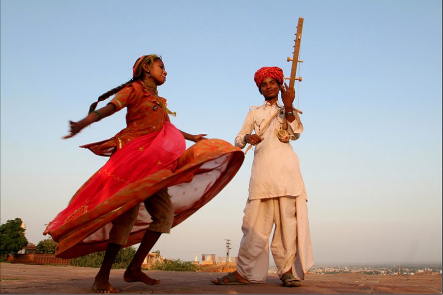 As the sun was setting outside the Mehrangarh Fort in Jodhpur, a brother and sister team, with the parents close by, got inspired by my interest in their music. For a full 10 minutes, this young girl gave me her most creative dance, even stumbling at one point from dizziness caused by her great effort. The instrument her brother was playing is called a pena, a bowed lute used in folk music, constructed of a bamboo rod attached to a gourd shell. Photograph by John Rizzo.