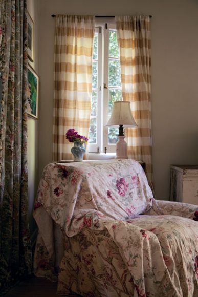 The artful impact of the layering of fabrics is seen in this detail of a guest room in a California home, as featured in “Shabby Chic Interiors: My Rooms, Treasures, and Trinkets” by Rachel Ashwell. © 2018 CICO Books. Photography by Amy Neunsinger.
