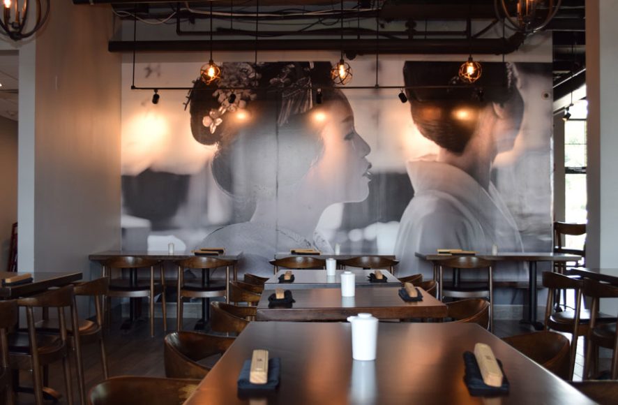 A floor-to-ceiling black-and-white photograph is the focal point of the sleek restaurant. Photographs by Aleesia Forni.