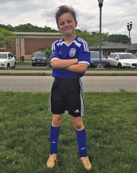 Matt's son, Spencer Osborne, right, who stars at youth soccer. Matt watches his son at play, always stressing that moderation is a key to success.