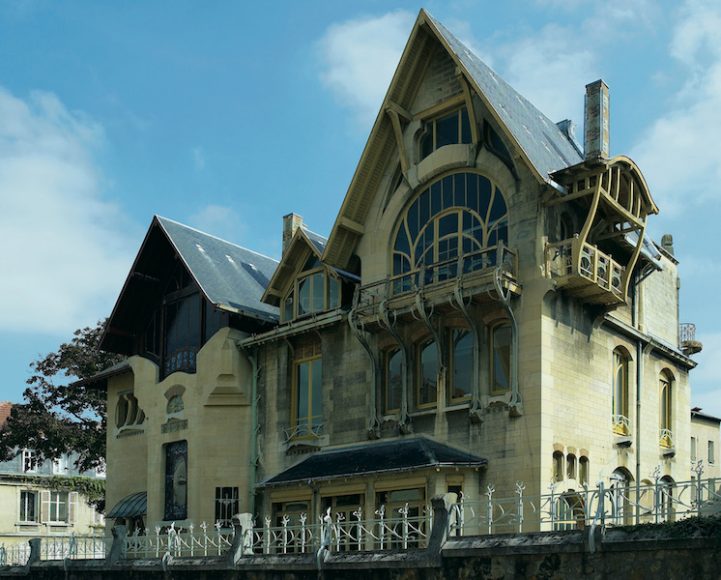 Henri Sauvage & Louis Majorelle, Villa Majorelle, 1902. Nancy, Lorraine, France. The first truly Art Nouveau building in Nancy, the three-story residence is an exuberant statement, with something of a fairy-tale quality, reinforced by the organic qualities of the window frames, balconies and ironwork, recalling bending boughs and plant-like tendrils enveloping and embellishing the stonework like some extraordinary architectural ivy. Photograph by Richard Powers, as featured in “The Iconic House: Architectural Masterworks Since 1900.” Courtesy Thames & Hudson.