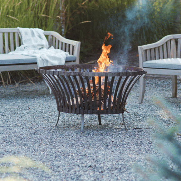 Outdoor, home and decorative goods from Terrain include the Oval Bonfire Basket.