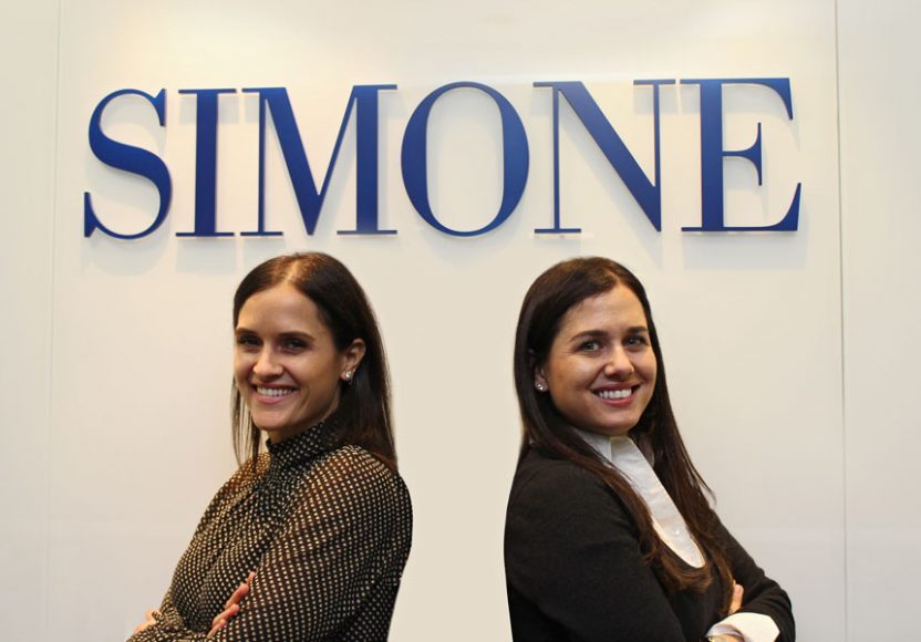Joanna Simone, left, with sister Patricia Simone at the Simone Development Cos. headquarters in the Bronx.