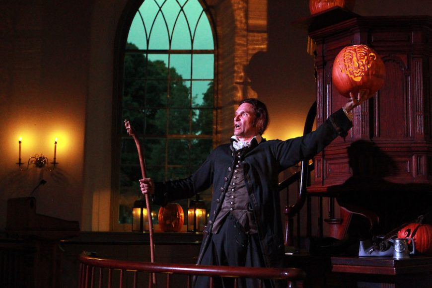 Master storyteller Jonathan Kruk in a dramatic moment from “The Legend of Sleepy Hollow” at Old Dutch Church there. Photograph by Jennifer Mitchell.
