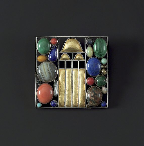 Josef Hoffmann (1870-1956). Brooch acquired by Helene Donner (née Klimt), 1907. Execution: Wiener Werkstätte, model no. G 686. Silver, partly gilt; agate, coral, lapis lazuli, malachite, turquoise, semi-precious stones. 5.1 x 5.1 cm (2 x 2 in.). Private Collection, courtesy Neue Galerie New York.