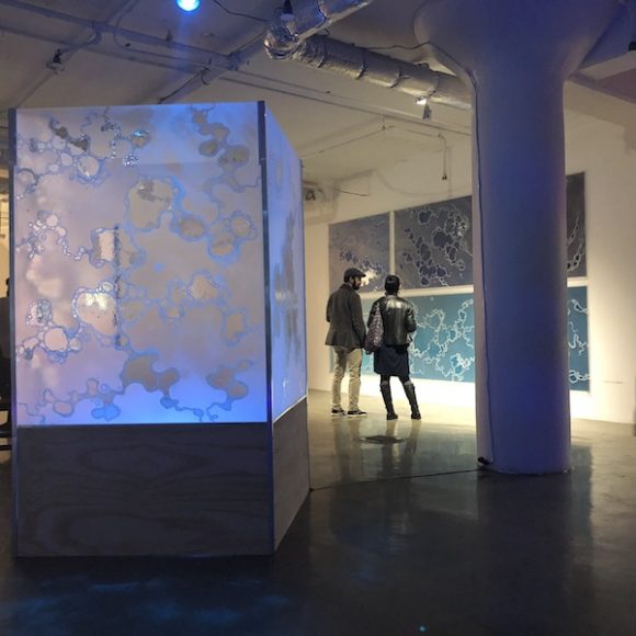 Gallery visitors explore the work of Hudson Valley mixed media artist Carla Goldberg, which continues in Brooklyn. Courtesy Carla Goldberg.