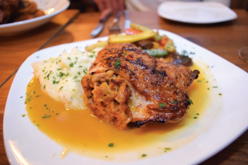 Stuffed leg of chicken with mashed potatoes and a sweet wine reduction. Photos by Aleesia Forni.