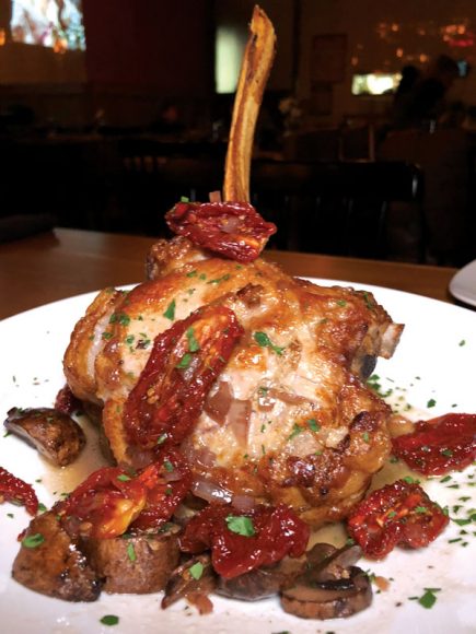 Pan-seared veal is dotted with sun-dried tomatoes and mushrooms.