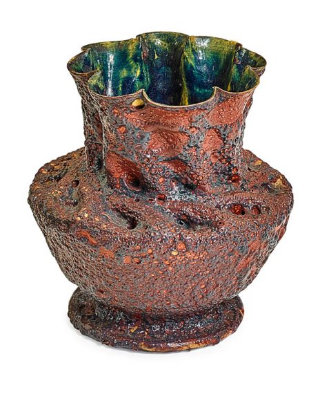 Vase with in-body twist and ruffled rim, pink and purple volcanic glaze (1897-1900), sold for $68,750 (estimate $35,000-45,000). Courtesy Rago Arts and Auction.