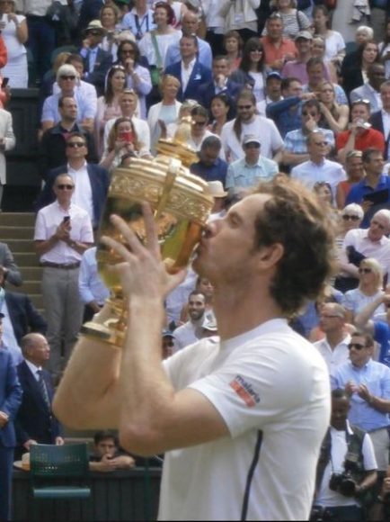 Andy Murray takes his second Wimbledon trophy in 2016. Photograph by Daniel J. Cooper.