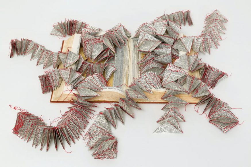 Swiss-born Vivian Rombaldi Seppey’s “Flying Words” (2014), made of dictionary and thread, is one of the many thought-provoking words in the touring exhibit “Freed Formats: The Book Reconsidered.”