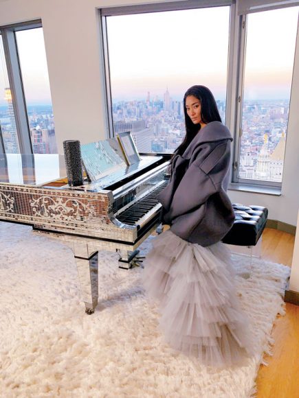 Chloe Flower wearing Michael Lungu with Liberace’s touring piano, on loan to her by The Liberace Foundation for the Creative Arts. Photographs courtesy Chloe Flower.