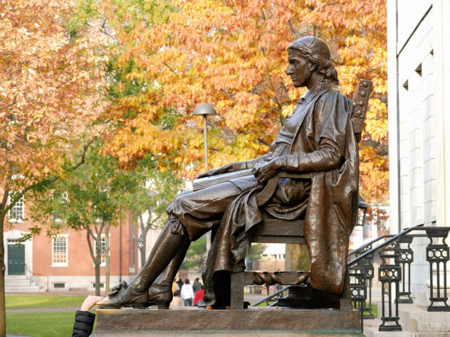 Statue of John Harvard in Harvard Yard. The English-born minister’s love of learning and bequest would lead to the establishment of Harvard College.