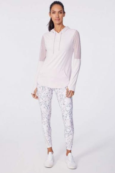 White pattern leggings and a white pullover with mesh detail are included in February’s Flower Bud’collection.