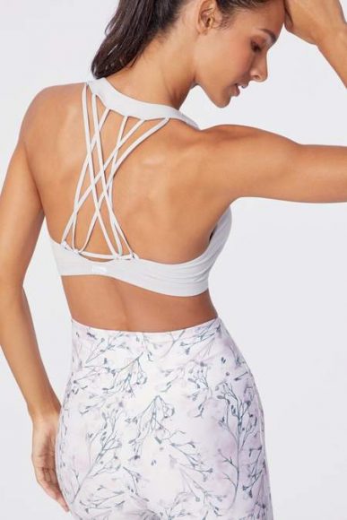 Strappy sports bras are trending in the activewear world.