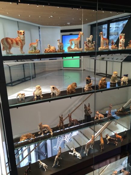 A multi-story vitrine filled with dog figurines is a highlight of the new American Kennel Club Museum of the Dog in Manhattan. Photograph by Mary Shustack.