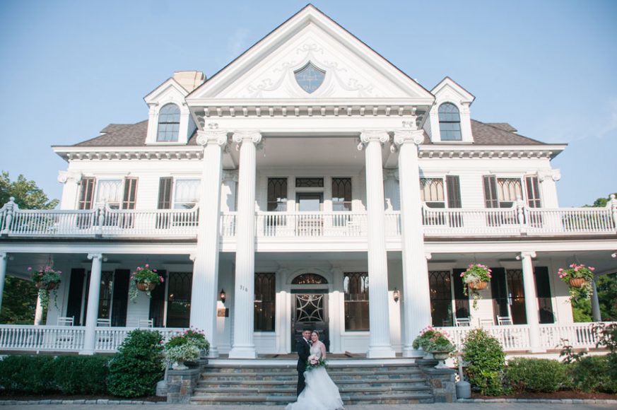 The Ionic support columns and double wraparound porches make for an impressive entrance at Lounsbury House. Courtesy Claudia – weddings & portraits.